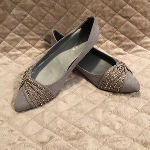 Brand new gray flats with gold detail.
